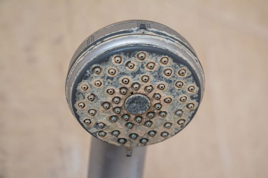 Hard Water Deposit And Rust On Shower Tap